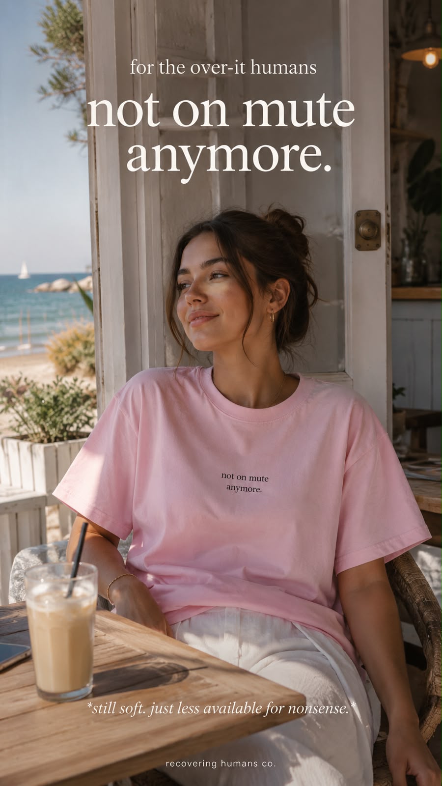 Woman in the soft pink not on mute anymore tee by the sea
